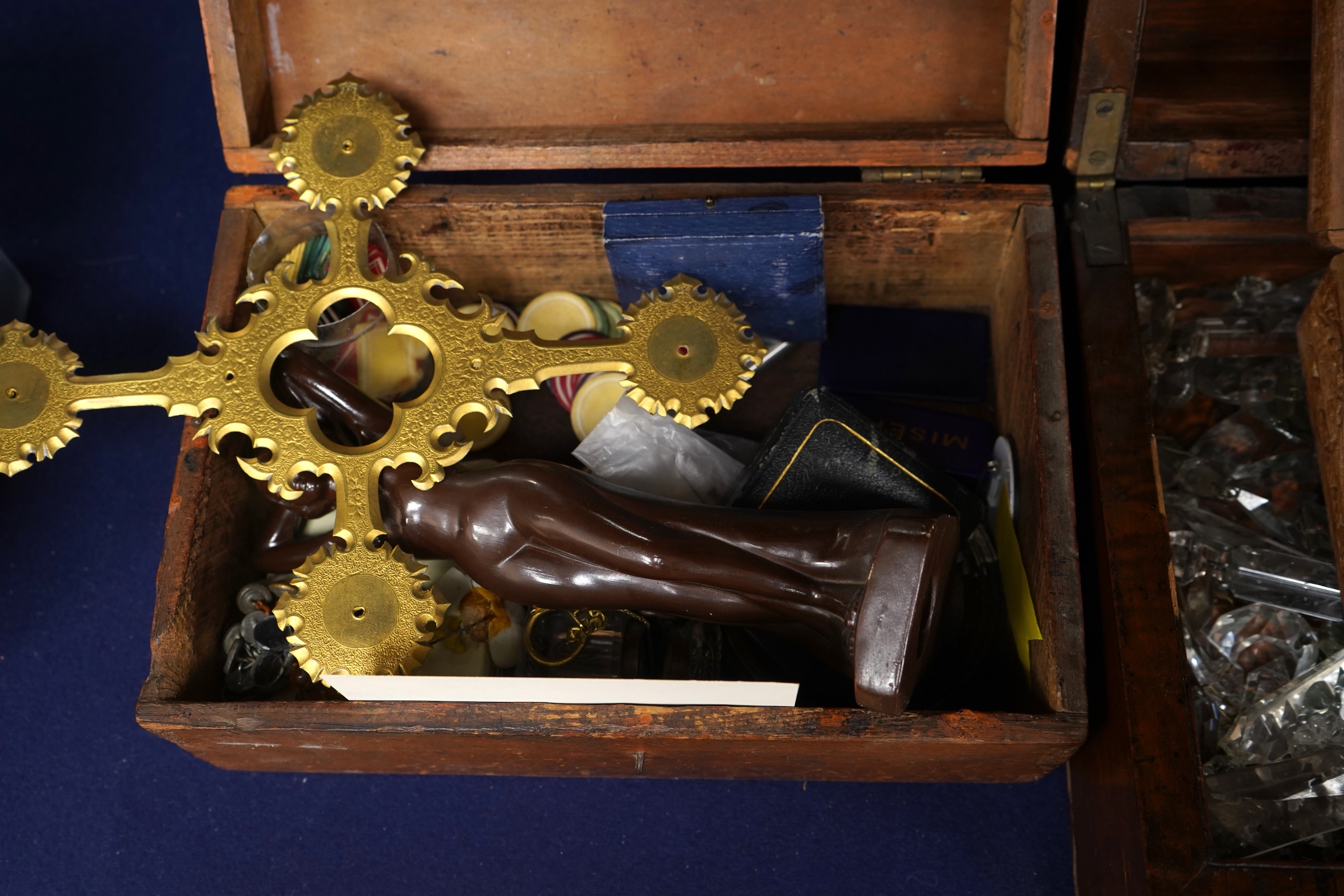 A box of cut glass drops, together with box of gaming counters, a gilt metal cross, an Art Deco ceramic nude figure, two frames, a parker pen, etc.